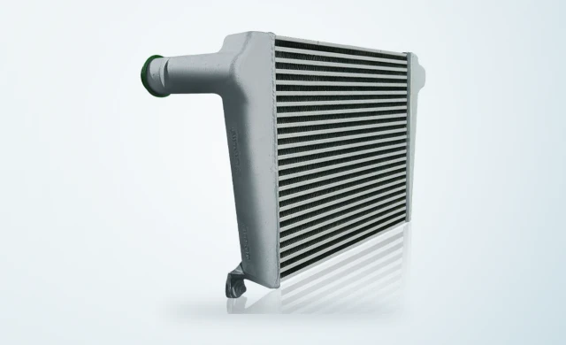 Bar and plate charge air cooler with cast aluminium tank